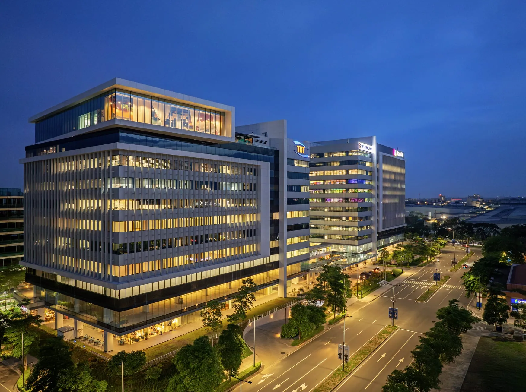 Evening view of West Aeropark office buildings along the main avenue