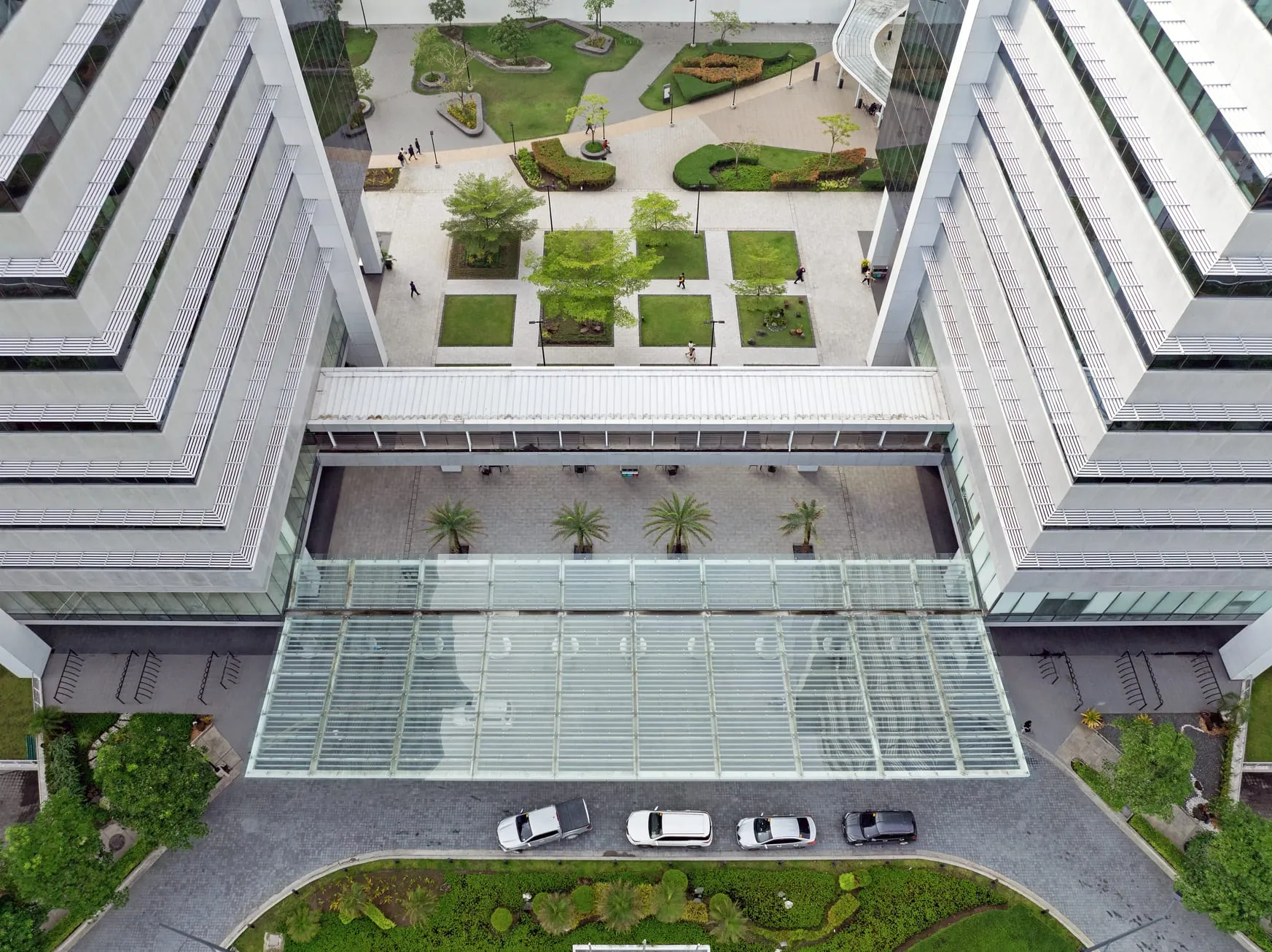 Aerial view of a landscaped courtyard and walkway between West Aeropark office buildings